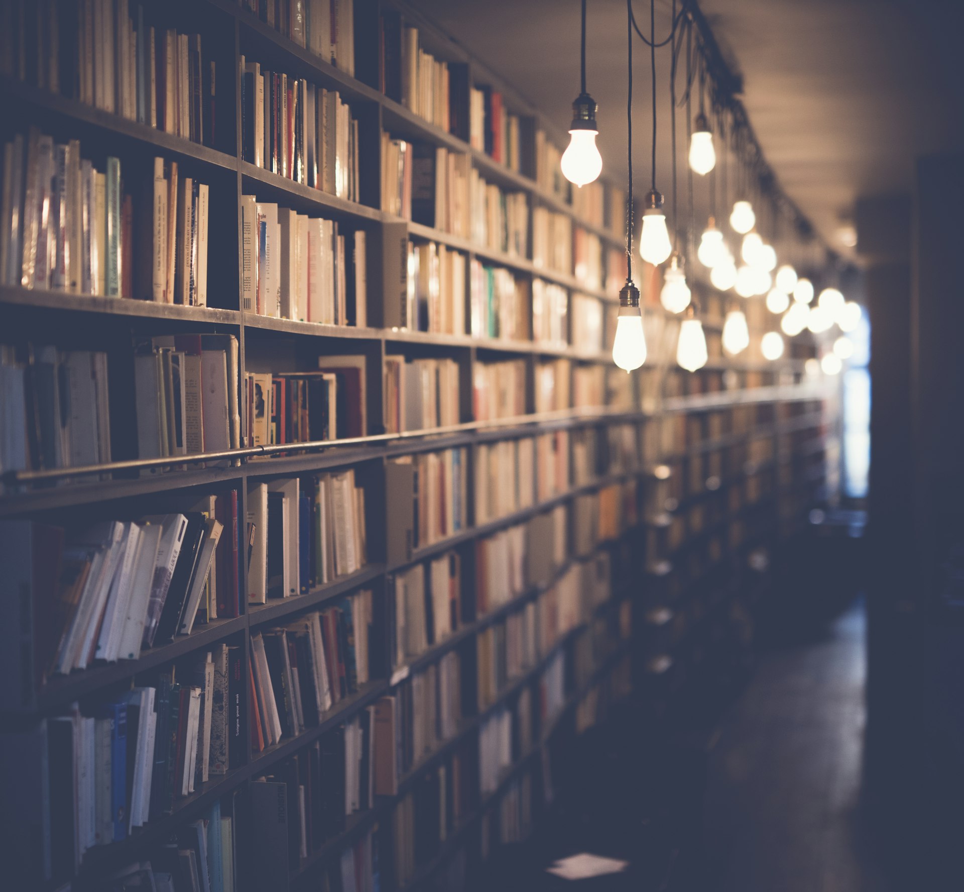 Old books and handwritten letters on a wooden desk